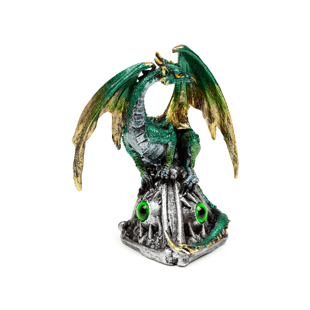 Front view of a green and gold dragon figurine with large wings, perched on a silver base featuring green jewel details and emerald eyes.