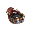 Angled view of a metallic red and gold dragon incense burner with blue eyes, its body coiled around a dark bowl rimmed with grey skulls and orange flame patterns.