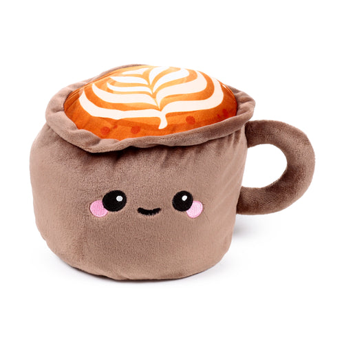 Angled view of a plush brown cappuccino coffee cup door stop, featuring an embroidered smiling face, white latte art swirls, and a side handle.