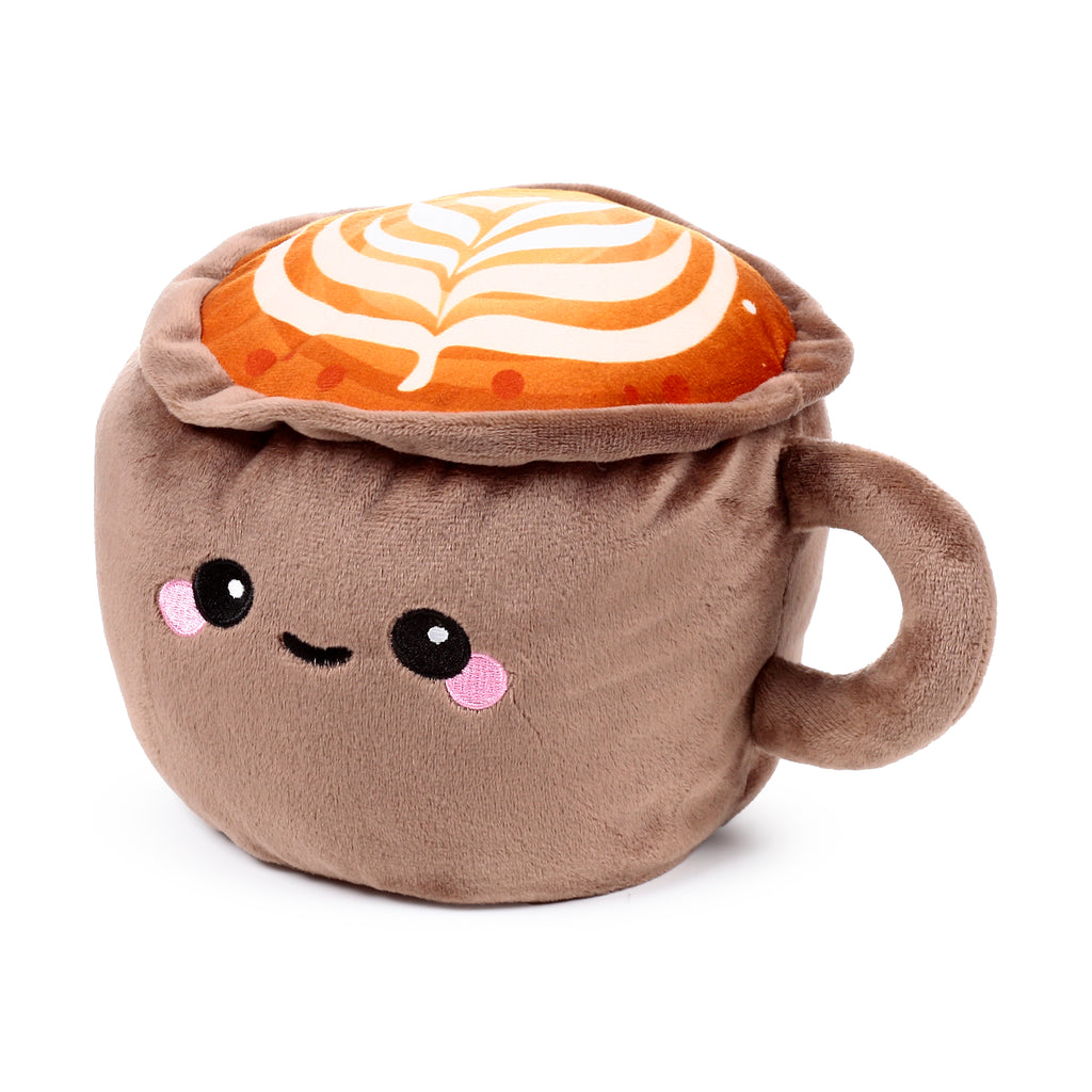 Front view of a brown plush door stop shaped like a cappuccino cup with a handle, featuring an embroidered cute face and a frothy top with white and orange latte art, on a white background.
