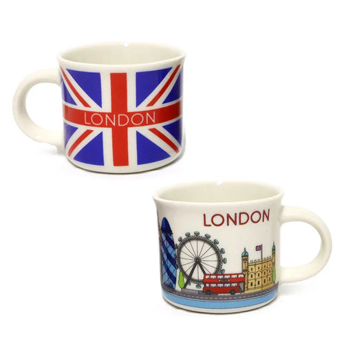 Angled view of two white porcelain espresso cups. One cup features a Union Jack flag design with 'LONDON' written across it, and the second cup shows a colourful wraparound illustration of London icons including the Gherkin, London Eye, and a red double-decker bus, also featuring 'LONDON' text.