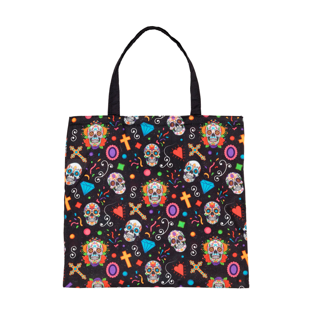 Front view of a black foldable shopping bag, featuring a vibrant Day of the Dead pattern with colourful sugar skulls, ornate crosses, red hearts, and geometric shapes, with black fabric handles.