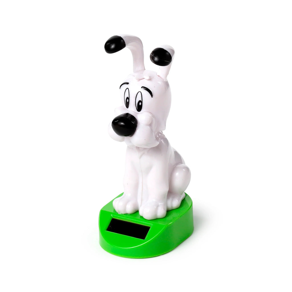 Angled front view of an Idefix (Dogmatix) Solar Pal, a white cartoon dog figure with black features, sitting on a bright green base that includes a black solar panel.