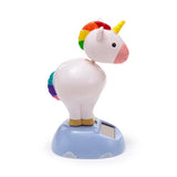 Angled side view of a white unicorn Solar Pal, featuring a rainbow mane, yellow horn, and rainbow tail, standing on a light blue cloud base with an integrated solar panel.