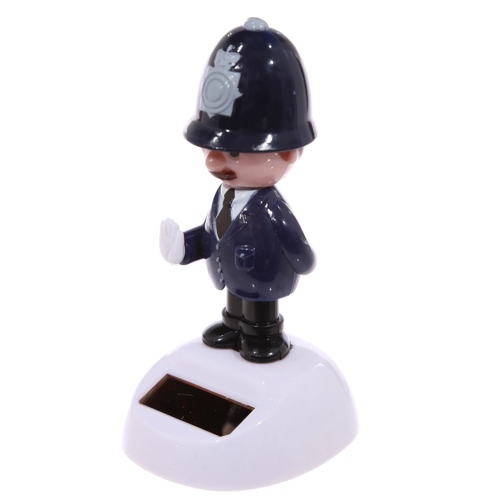 Angled view of a Policeman Solar Pal figure wearing a dark blue uniform including a helmet with a grey badge, a white shirt, and black tie, with one hand raised, standing on a white base featuring a solar panel.