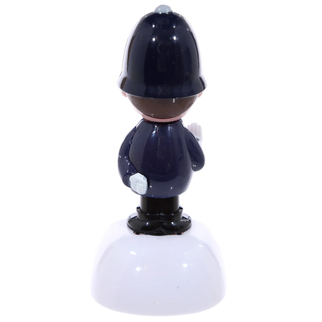 Policeman Solar Pal, back view, in dark blue uniform and helmet, on a white domed base.