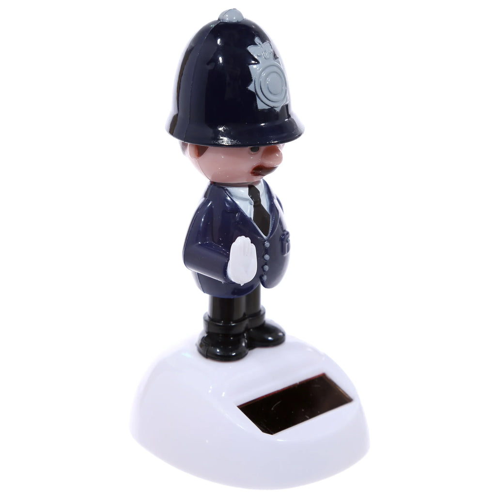 Angled front view of a Policeman Solar Pal figurine, dressed in a dark blue uniform and police helmet with a grey emblem, standing on a white base with a black solar panel.