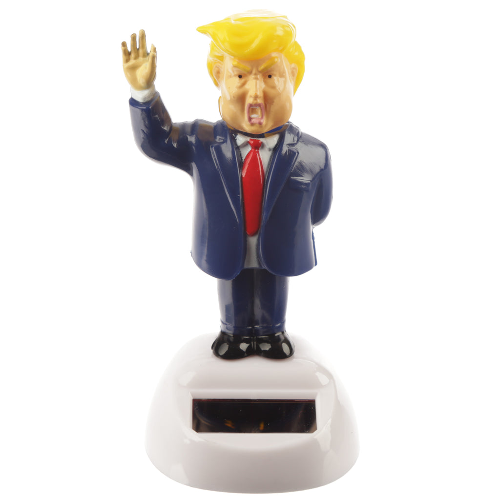 Front view of a Collectable President Solar Pal figurine with yellow hair, blue suit, red tie, open mouth, and raised arm, standing on a white solar panel base.