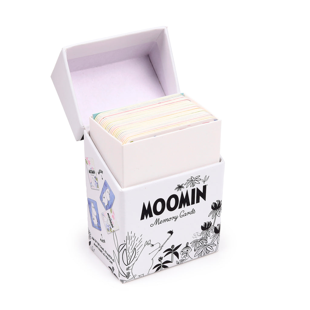Angled view of an open white Moomin memory card set box, revealing a stack of colourful cards and illustrations of Moomin characters on its sides.