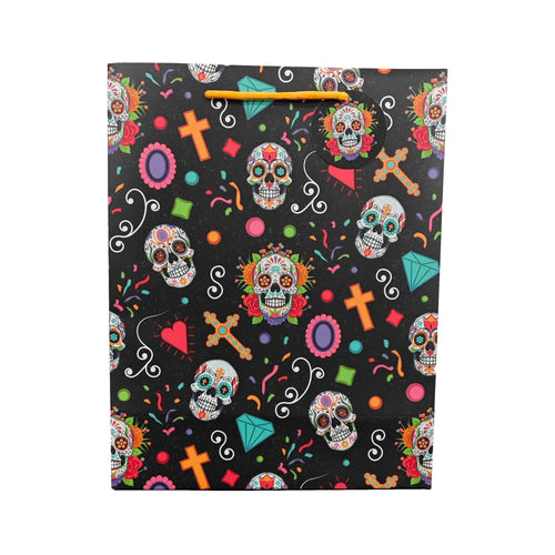 Front view of a large black gift bag featuring a vibrant Day of the Dead pattern with sugar skulls, colourful crosses, hearts, diamonds, and orange rope handles.