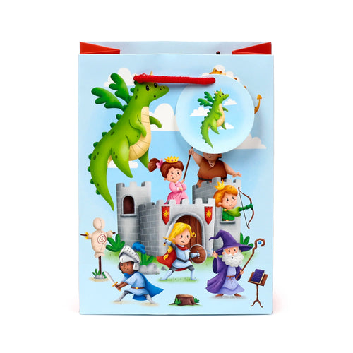 Front view of a light blue gift bag, adorned with a vibrant cartoon fantasy scene featuring a large green dragon, a grey castle, a princess, knights, and a wizard. A distinct circular graphic, depicting a smaller green dragon, is visible on the upper right, and the bag has red rope handles.