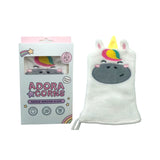 White unicorn makeup remover glove with colourful mane, yellow horn, and embroidered face, displayed next to its light blue and pink retail packaging.