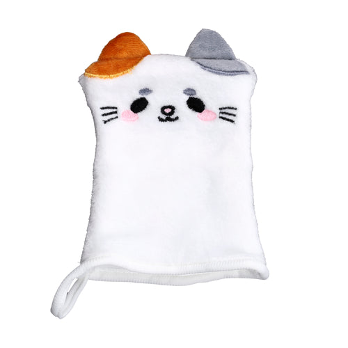 Front view of a white, plush makeup remover glove designed as a cat. It features an embroidered cat face with one orange and one grey ear, pink cheeks, and black whiskers. A white hanging loop is visible on the left side.