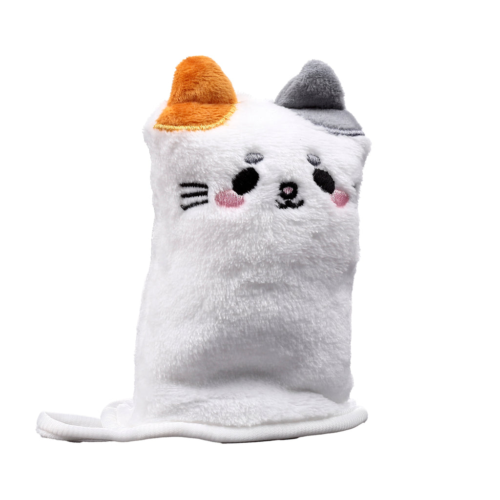 Front view of a white, fluffy cat makeup remover glove, featuring embroidered black eyes, pink cheeks, and a black nose, with one orange ear and one grey ear on top.