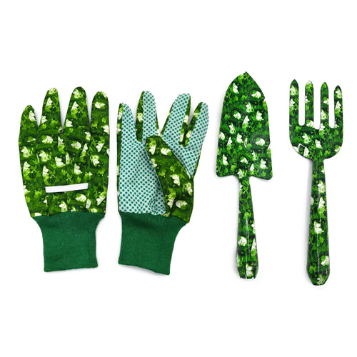 Overhead view of a three-piece green gardening set, including a pair of gardening gloves, a hand trowel, and a hand fork. The gloves feature dark green cuffs and lighter green polka dot palms. All items display a vibrant green pattern with white Moomin characters amongst foliage.