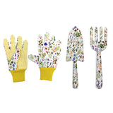 Viewed from above, a three-piece gardening set featuring a pair of white gloves with yellow cuffs and dotted palms, a trowel, and a hand fork. All items are decorated with a vibrant floral and bee pattern on a white background.