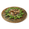 Round Greenman ashcatcher incense burner, overhead view, featuring a bronze and green leaf-textured face with Celtic knotwork accents, on a white background.