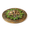 Angled top view of a round Greenman ashcatcher incense burner, detailed with a face of green leaves and bronze Celtic knotwork with teal accents.
