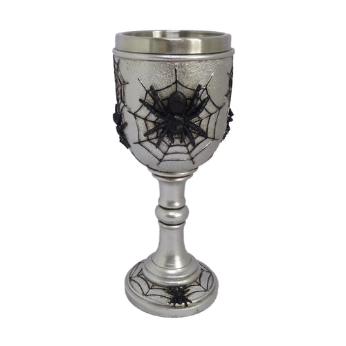 Decorative silver-coloured goblet, featuring a prominent black spider on a web on its textured bowl, with additional smaller spiders on the base.
