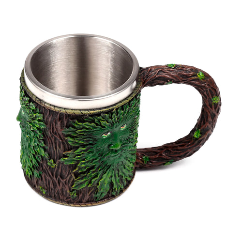 Angled decorative tankard, showing a prominent green foliage Treeman face, brown bark texture, tree branch handle, and metallic interior.
