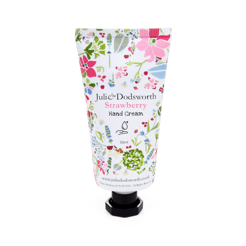 Front view of a white Julie Dodsworth hand cream tube with a colourful pink and green botanical pattern, featuring 'Strawberry Hand Cream 50ml' text and a black cap.