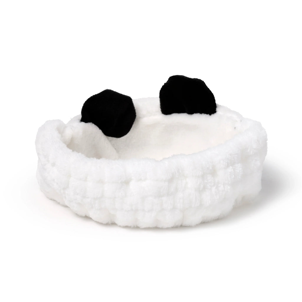 Front view of a plush white panda headband with black ears on a white background.