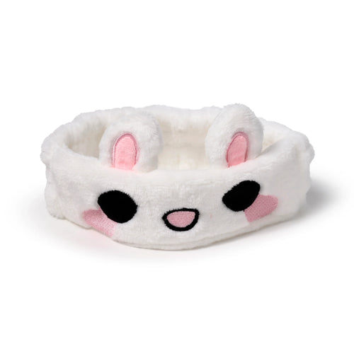 Front view of a white plush headband with pink-lined bunny ears and an embroidered rabbit face.