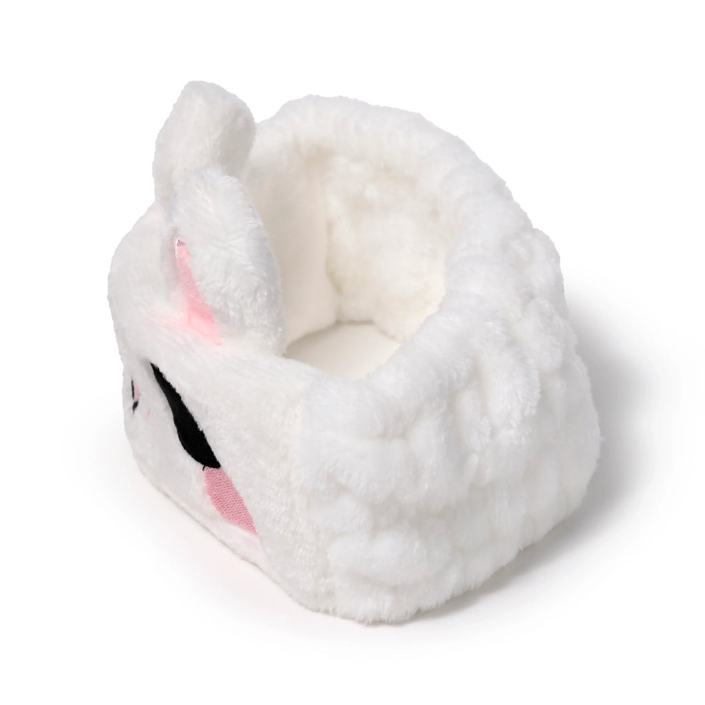 White plush rabbit headband with black eyes and pink accents, shown from an angled top-down view on a white background.