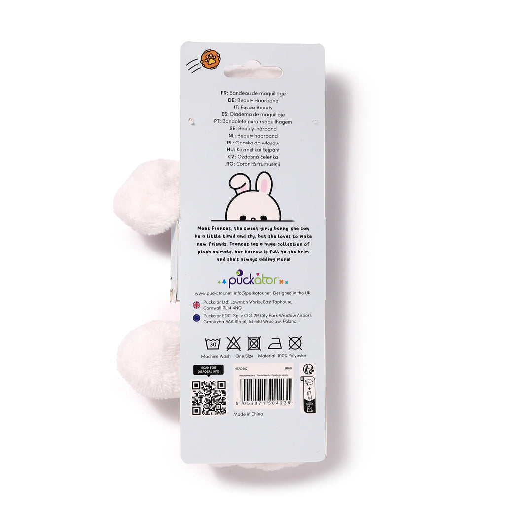Back view of a white plush rabbit headband on its retail packaging.