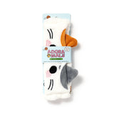 Front view of a plush white headband designed to resemble Lola the Cat, featuring embroidered black eyes, pink cheeks, and grey ears. It is displayed on a light blue polka dot display card.