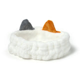 Angled product shot of a plush white headband featuring a grey cat ear and an orange cat ear.