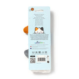 Overhead view of a plush headband, featuring visible orange, grey, and white sections, attached to a light blue retail hang tag with a cartoon cat illustration.