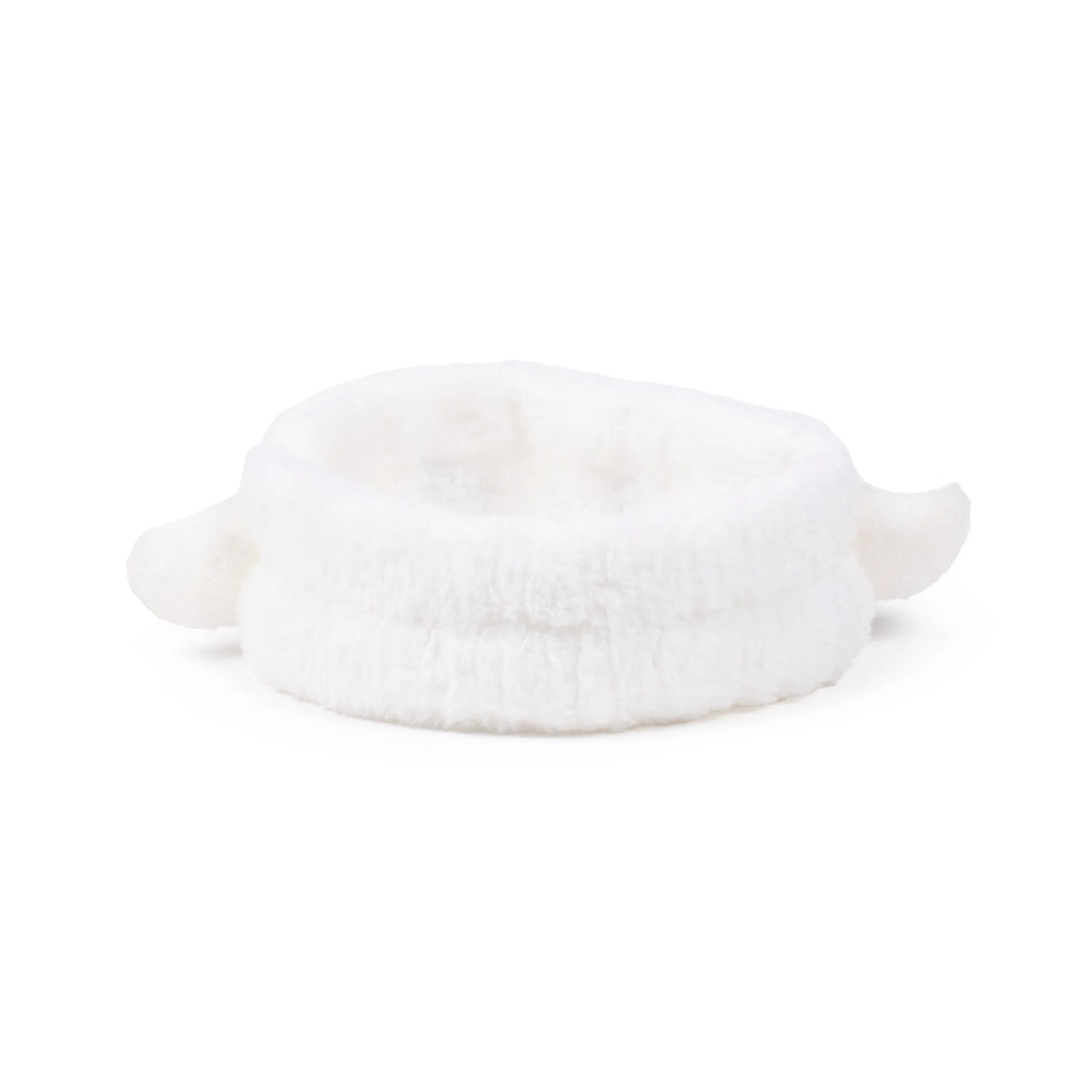 Angled view of a white plush headband with two ghost-shaped details.