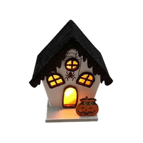 Front view of an LED Halloween spooky house decoration, with a black glitter roof, illuminated orange windows and an arched entrance, a spiderweb, a black spider, and an orange carved pumpkin.