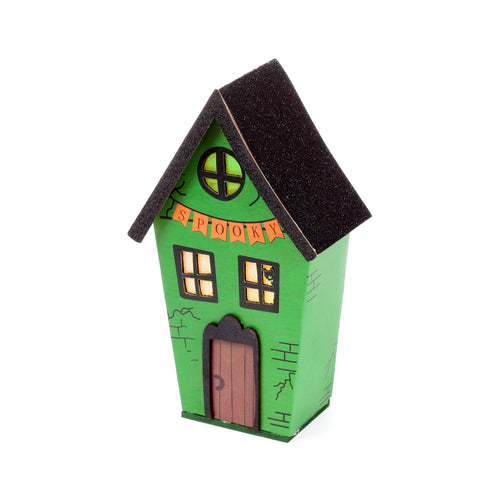 Angled view of a green Halloween tall spooky house LED decoration, with a glittery black roof, 'SPOOKY' banner, illuminated windows, and a black cat silhouette.