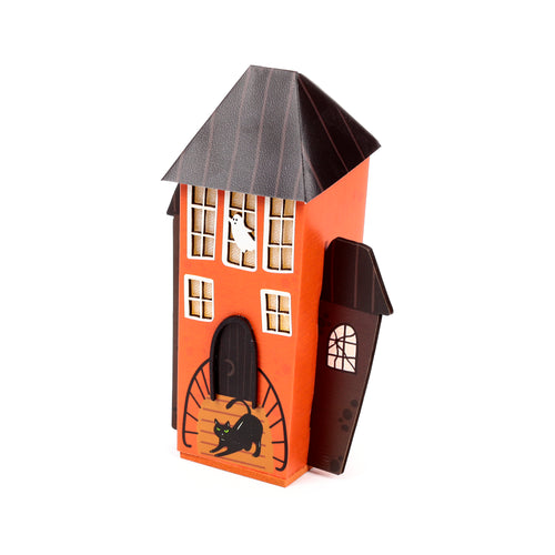Angled view of an orange LED Halloween spooky house decoration, with a dark brown textured roof, depicting a black cat on the doorstep and a ghost in an upper window.