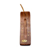 Angled top-down view of a sheesham wood ashcatcher incense stick burner, featuring gold-coloured pentagram and stars inlay. An incense stick is in the holder.