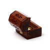 Angled view of a dark Sheesham wood incense cone burner box with its lid open. The box features decorative cut-outs on the lid, a brass elephant inlay on the side, and a golden-coloured cone holder inside.