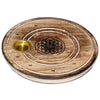 Angled view of a round mango wood incense holder, featuring a golden cone burner, multiple brass stick holes, and a central engraved Flower of Life design.