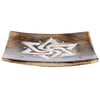 Angled view of a square, dark mango wood incense ashcatcher, carved with a white geometric star pattern and featuring four brass-coloured holes for incense sticks.