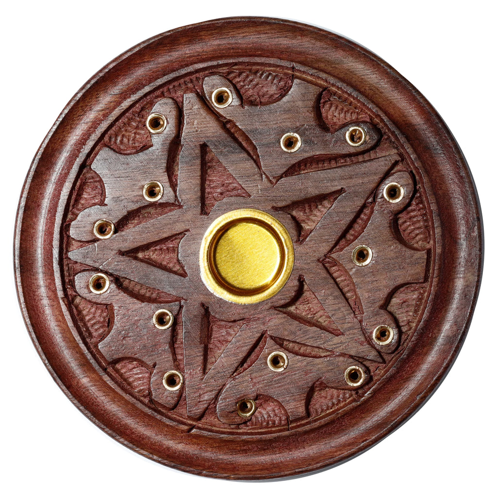 Top-down view of a round sheesham wood ashcatcher incense holder with a carved star design, featuring a central gold-coloured cone burner and multiple brass-coloured holes for incense sticks.