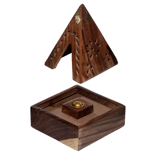 Angled view of a dark brown Sheesham wood pyramid incense cone burner, with a brass elephant inlay and carved patterns on its pyramid top, shown separated from its square base containing a brass cone holder.