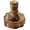 Angled view of a dark brown carved mango wood incense burner, featuring a golden-coloured holder and a scalloped base with intricate patterns.