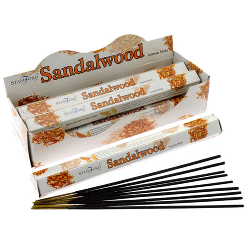 Sandalwood incense sticks with packaging on a white background