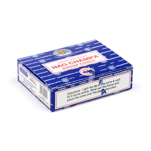 Angled view of blue and white Nag Champa dhoop incense cones packaging, with the product name and a portrait of an old man on the top, and usage instructions visible on a side panel.