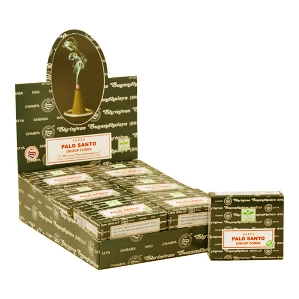 Angled view of a dark olive retail display box filled with Palo Santo dhoop incense cone packs. A separate matching pack of Palo Santo incense cones is next to the display. The display box features an oval header depicting a smoking incense cone.