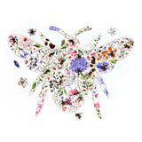 Top-down view of a large, bee-shaped wooden jigsaw puzzle featuring a vibrant floral meadow design with bumblebees and colourful flowers. A few smaller, shaped puzzle pieces depicting a bee, a flower, and a leaf are placed around it on a white background.