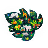 130pc wooden jigsaw puzzle, shaped as a large green jungle leaf, featuring colourful animal-shaped pieces including a rhinoceros, giraffe, lion, elephant, tiger, and zebra, set against a dark green jungle background, shown from an overhead view.