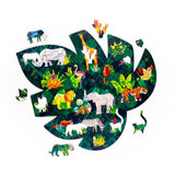 Overhead view of a 130pc wooden jigsaw puzzle shaped like a large green tropical leaf, depicting various colourful safari and jungle animals, with some animal-shaped pieces removed.