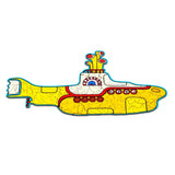 Assembled wooden jigsaw puzzle depicting The Beatles Yellow Submarine, featuring a predominantly yellow hull with red and white detailing, a blue outer border, and visible interlocking puzzle piece lines.